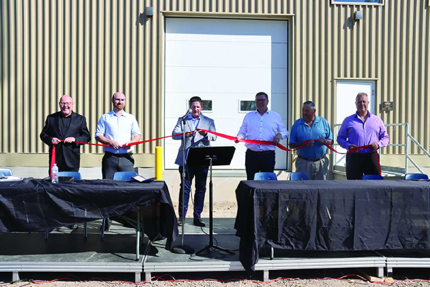 From left Moosmin-Montmartre MLA Kevin Weedmark, KGS engineer David Germin, Moosomin Mayor Murray Gray cutting the ribbon, Saskatchewan Premier Scott Moe, former mayor Larry Tomlinson, and town of Moosomin CAO Paul Listrom